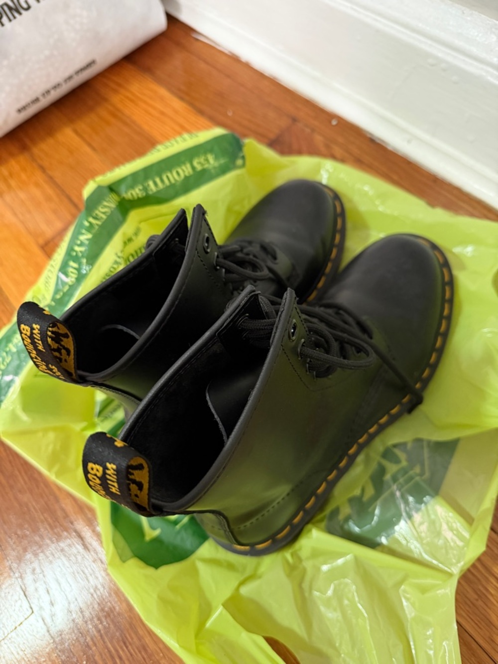 Dr. Martens Black Leather Ankle Boots with Yellow Stitching